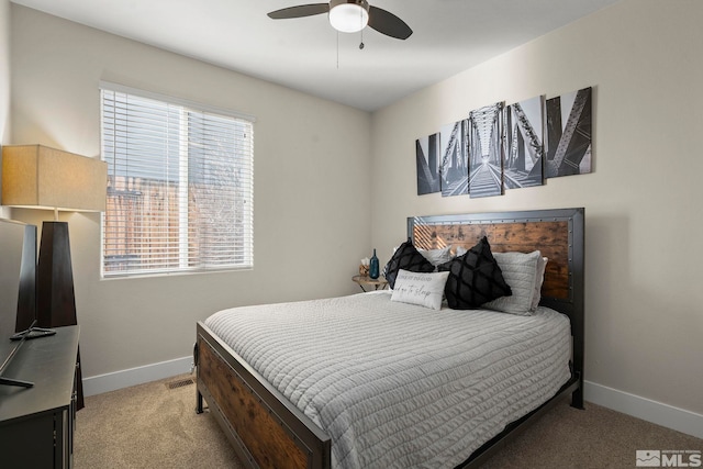 bedroom with ceiling fan and light colored carpet