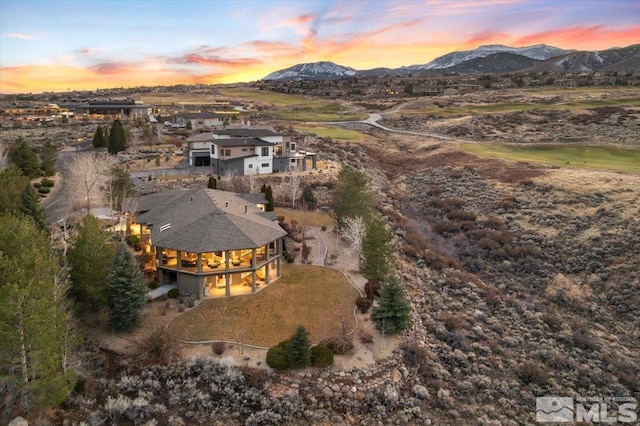 aerial view at dusk with a mountain view