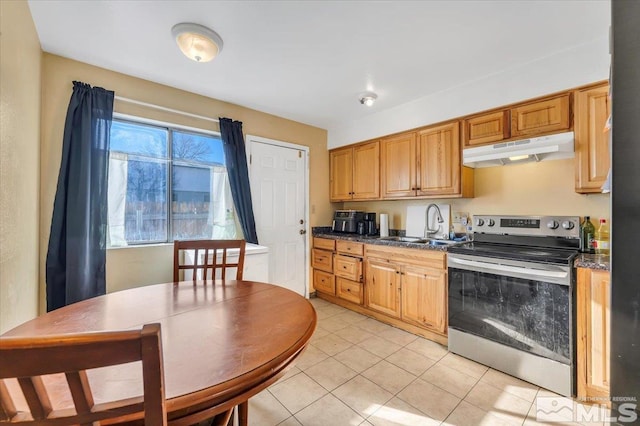 kitchen featuring stainless steel electric stove, light tile patterned flooring, and sink