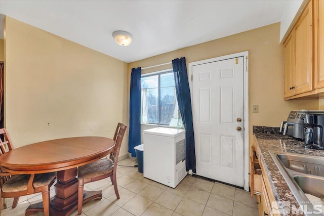 tiled dining area with sink