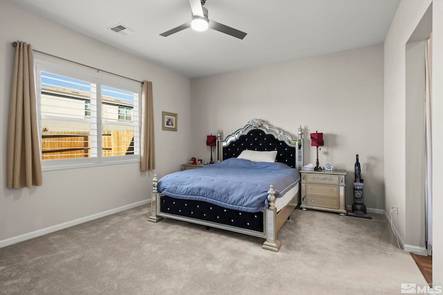 bedroom with ceiling fan and light colored carpet