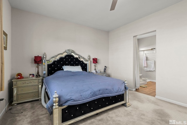 bedroom featuring ensuite bathroom, ceiling fan, and carpet floors