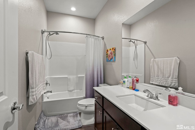 full bathroom with shower / bath combo, vanity, and toilet