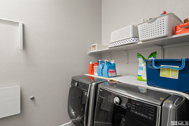 clothes washing area with independent washer and dryer