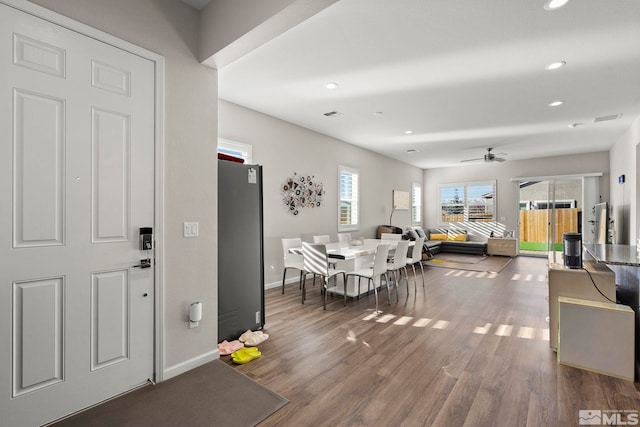 interior space with wood-type flooring and ceiling fan