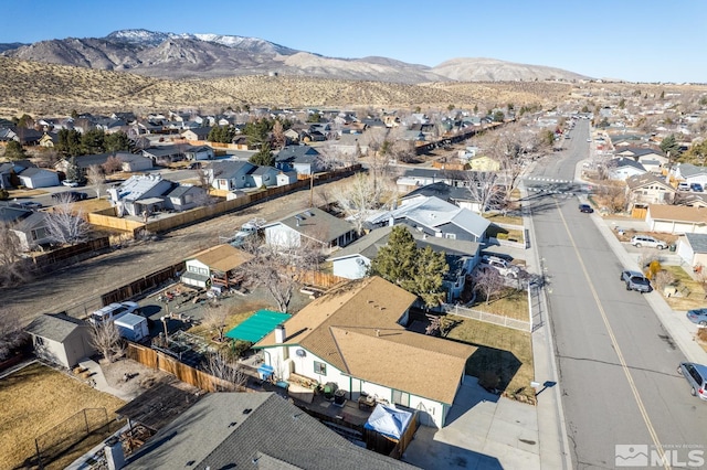 birds eye view of property with a mountain view