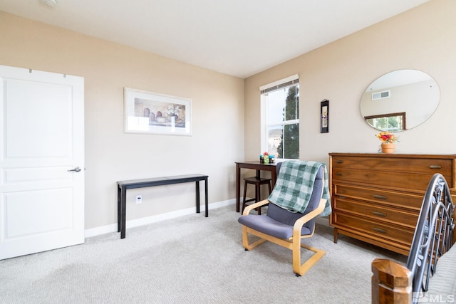 sitting room with light colored carpet