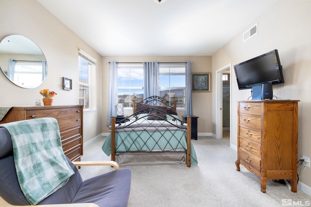 bedroom with light carpet