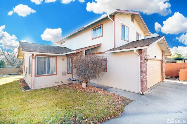 view of front of home with a garage and a front lawn