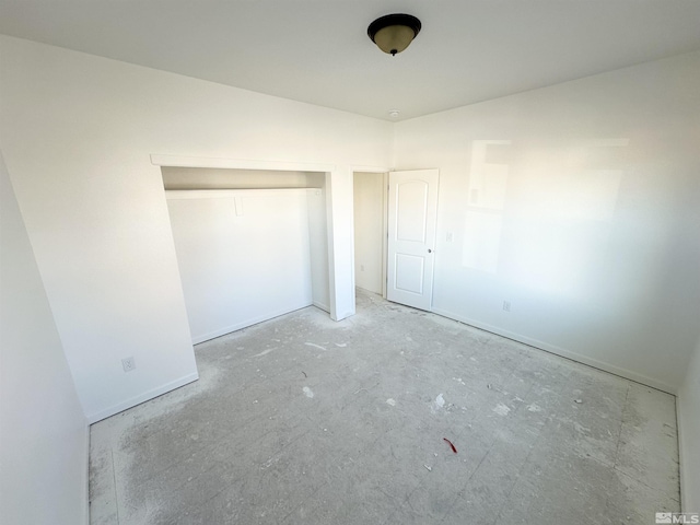 unfurnished bedroom with a closet