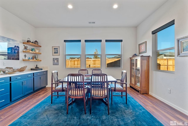 dining space featuring dark hardwood / wood-style floors