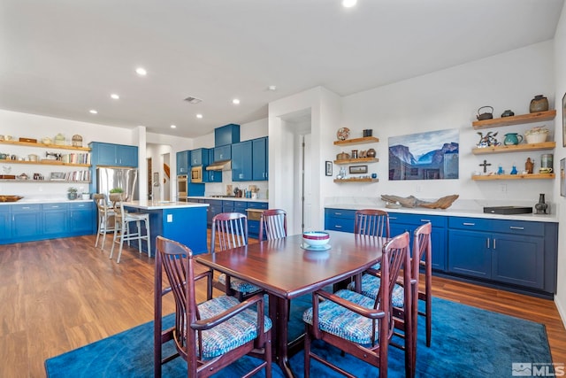 dining space featuring dark hardwood / wood-style flooring