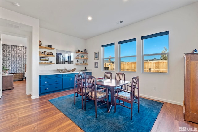 dining space with dark hardwood / wood-style floors