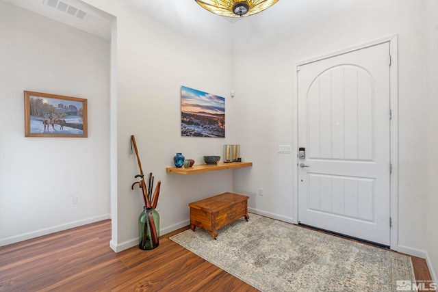 entrance foyer featuring dark hardwood / wood-style floors