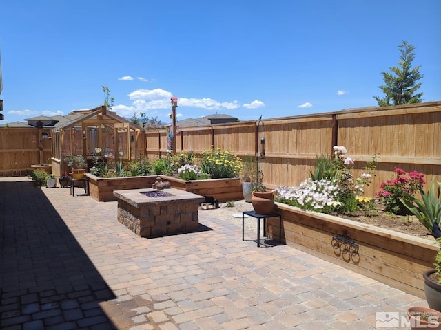 view of patio featuring an outdoor fire pit