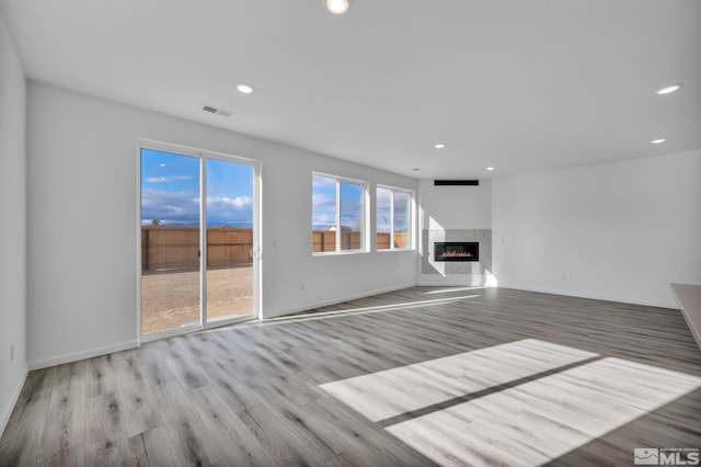 unfurnished living room featuring light wood-type flooring