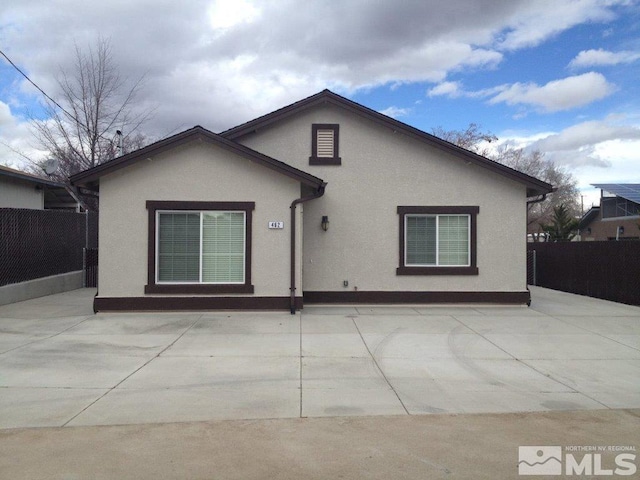 rear view of property featuring a patio