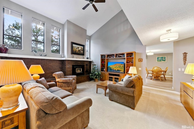 carpeted living room featuring ceiling fan, lofted ceiling, and a wood stove