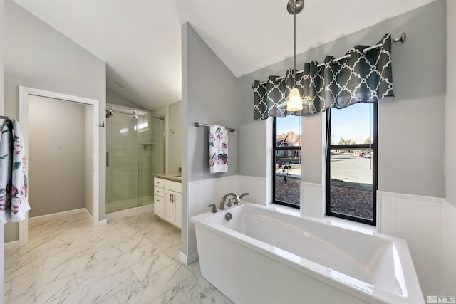 bathroom with vanity, lofted ceiling, and shower with separate bathtub