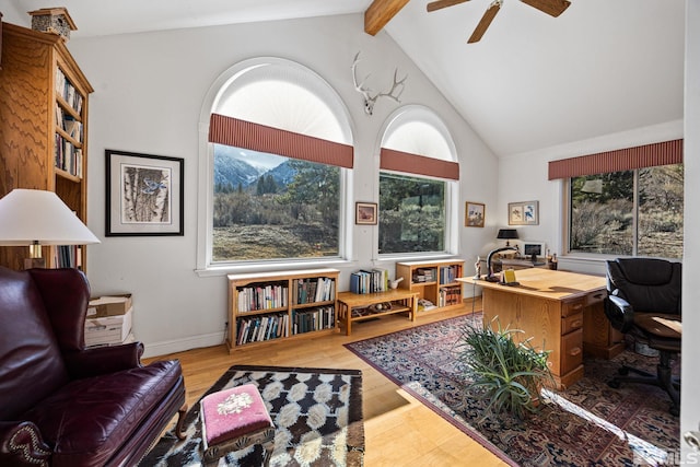 home office with hardwood / wood-style flooring, ceiling fan, and lofted ceiling with beams