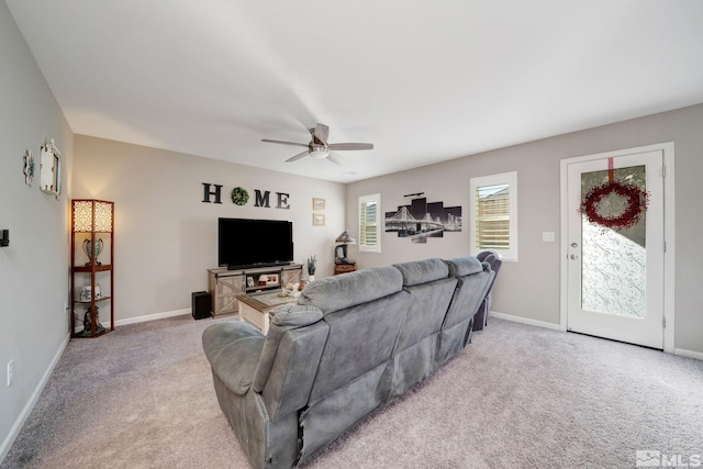 living room with light carpet and ceiling fan