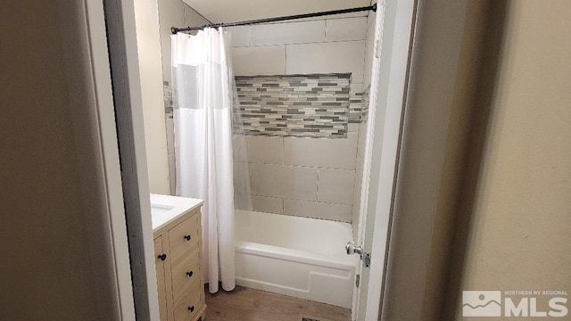 bathroom with vanity and shower / bathtub combination with curtain