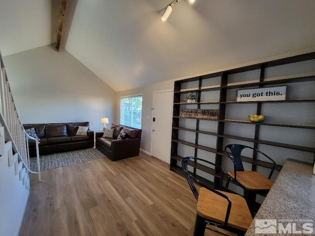 home office with vaulted ceiling with beams and wood-type flooring