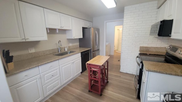 kitchen with range with electric cooktop, sink, light hardwood / wood-style flooring, dishwasher, and white cabinets