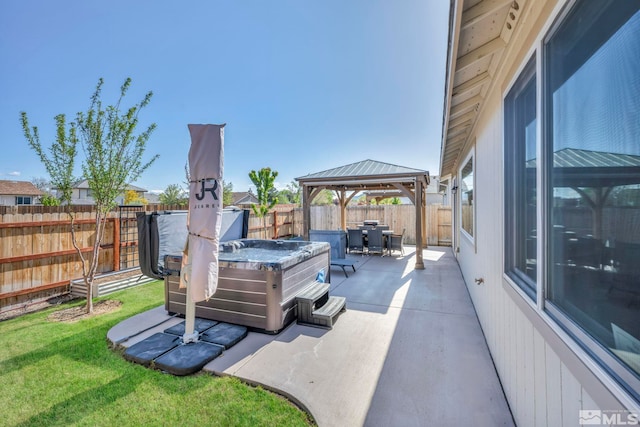 view of patio / terrace with a gazebo and a hot tub