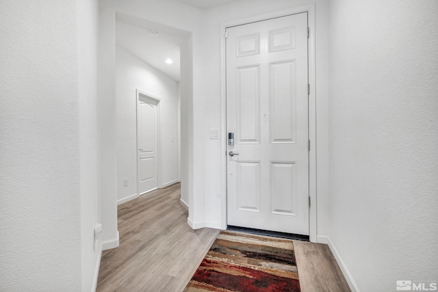 doorway to outside featuring light hardwood / wood-style floors