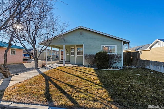 view of front of property featuring covered porch and a front yard