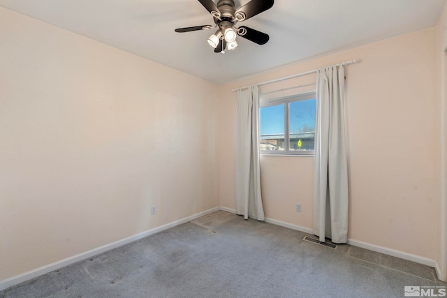 unfurnished room with ceiling fan and light colored carpet