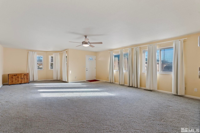 unfurnished room with light carpet and ceiling fan