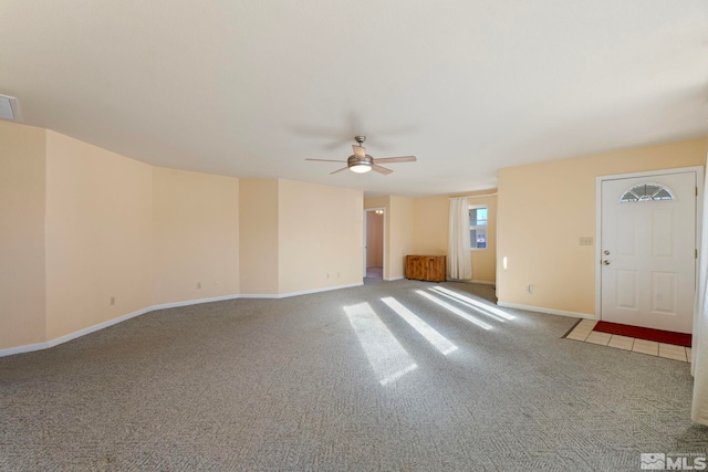 interior space with carpet and ceiling fan