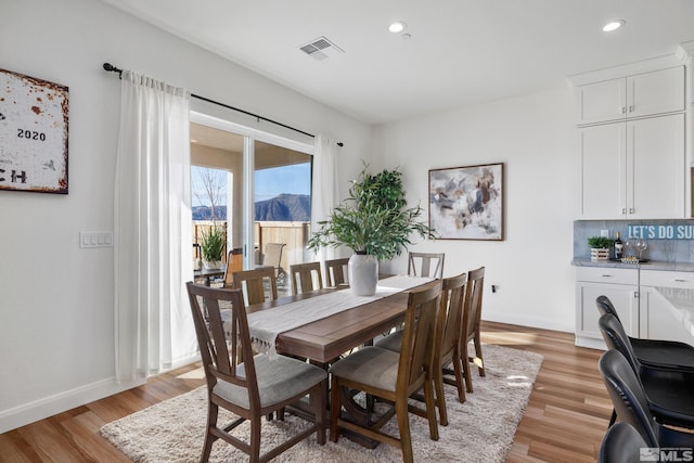 dining area with light hardwood / wood-style floors