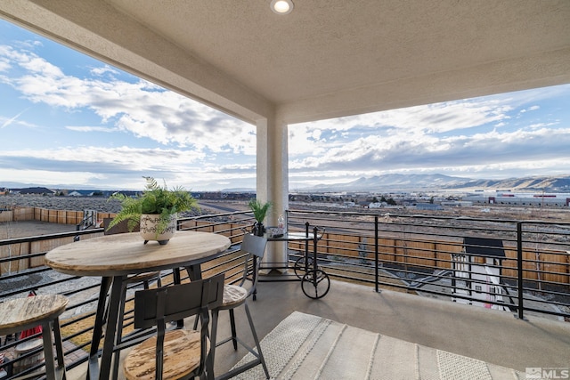 balcony featuring a mountain view