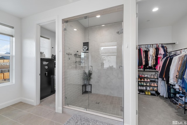 bathroom with tile patterned floors and an enclosed shower