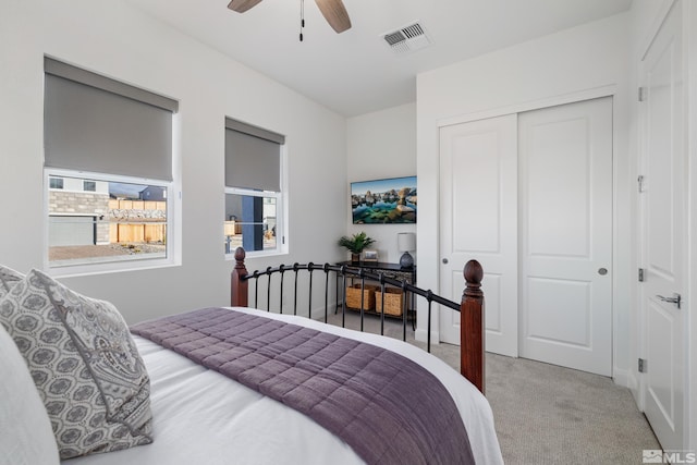 bedroom with carpet floors, a closet, and ceiling fan