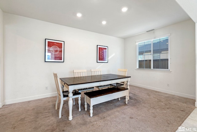 view of carpeted dining area