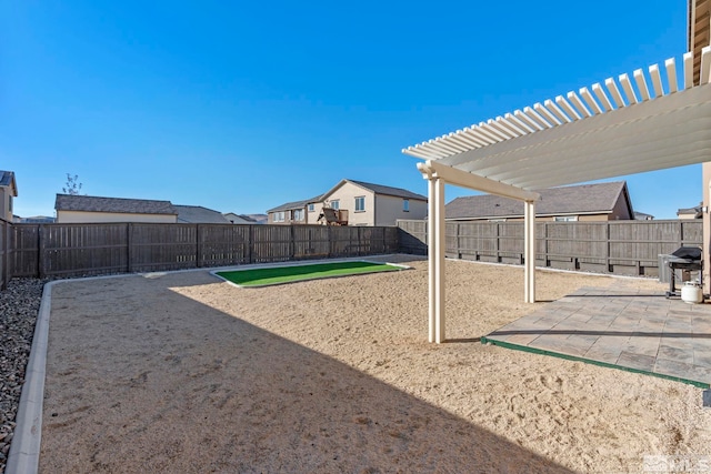 view of home's community with a pergola and a patio