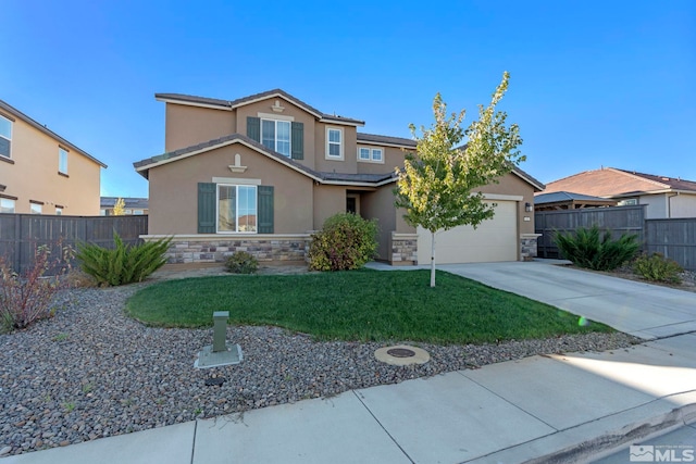 view of front of home with a garage and a front yard