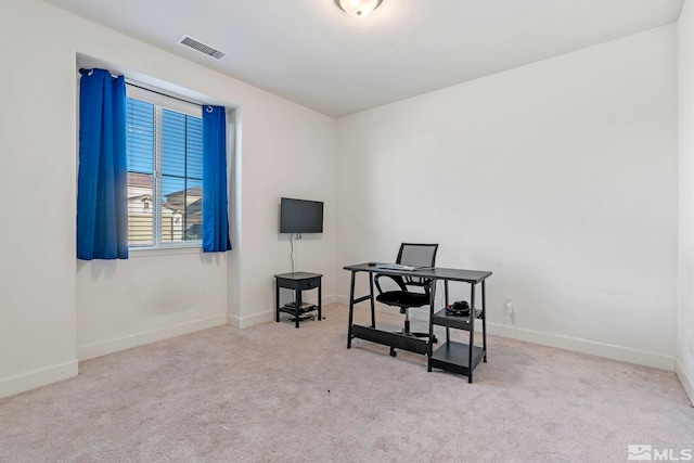 office space with light colored carpet