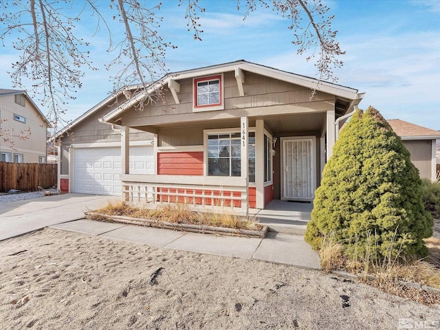 view of front of home featuring a porch and a garage