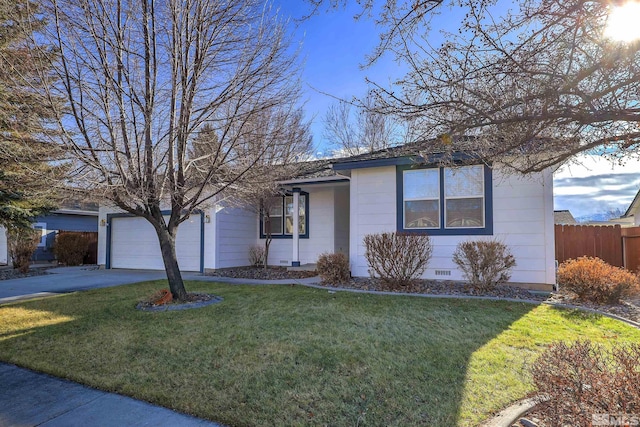 ranch-style house featuring a front lawn and a garage