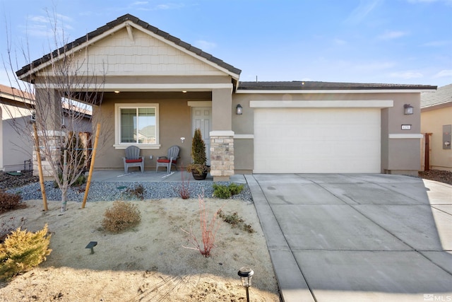 view of front of home featuring a porch and a garage