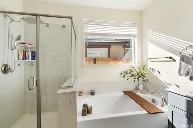 bathroom featuring vanity and separate shower and tub