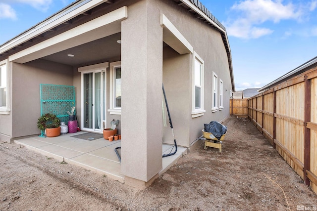 back of property featuring a patio