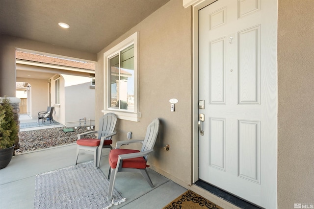 doorway to property featuring covered porch