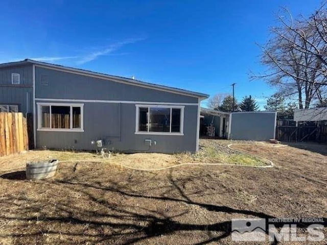 view of home's exterior with fence