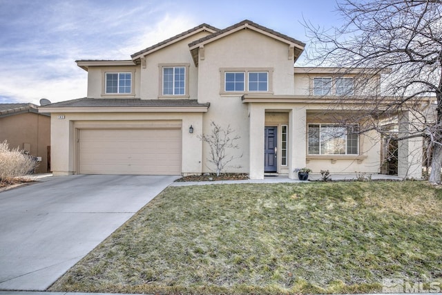 view of front property featuring a front yard and a garage